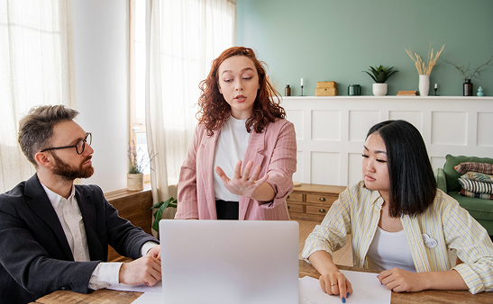 Professionals reviewing property and financial matters