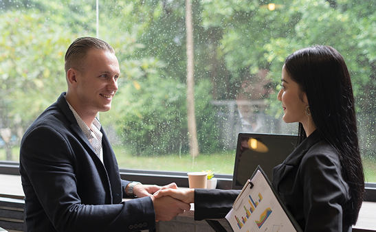 Professionals shaking hands after mediation